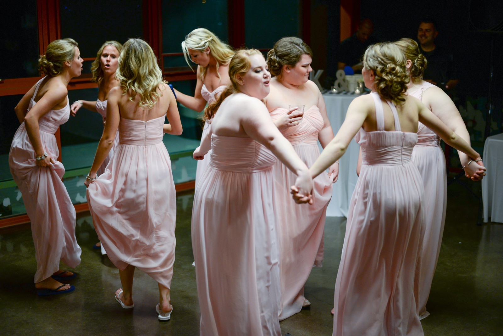pink-bridesmaids-dancing-at-the-reception