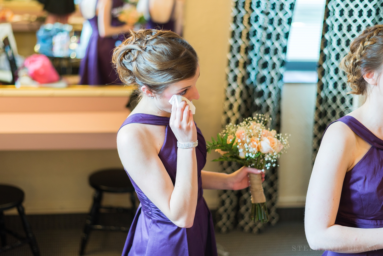bridesmaid sheds a tear during prayer