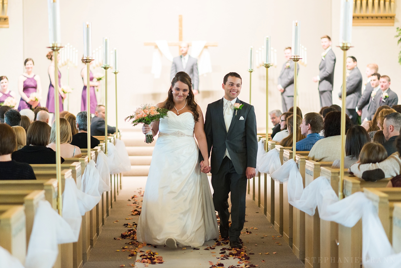 wedding couple coming back down the aisle after just being married