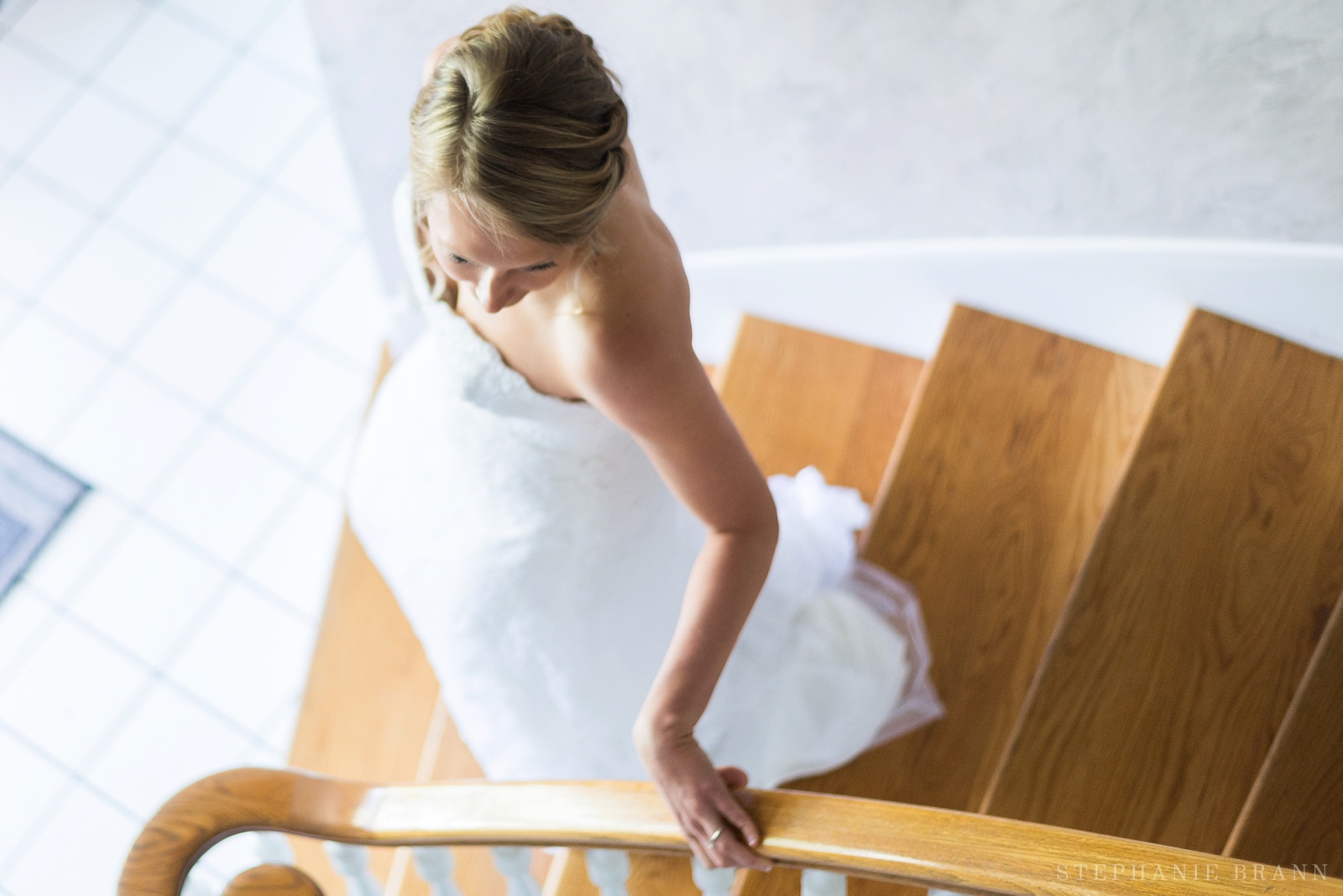 girl-walking-down-the-stairs-on-her-wedding-day