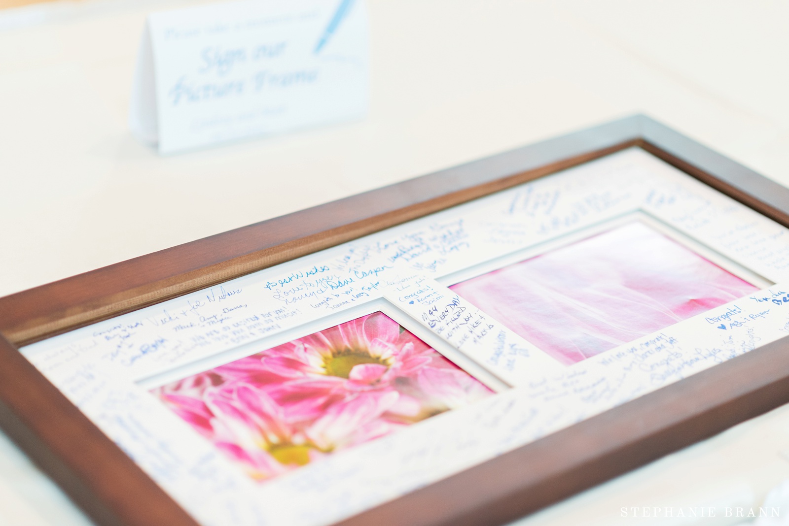 signatures-on-a-picture-frame-that-wedding-guests-signed