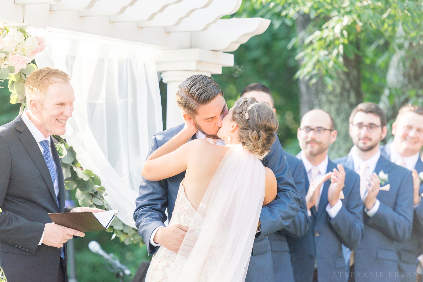 couple-kissing-at-a-wedding-ceremony