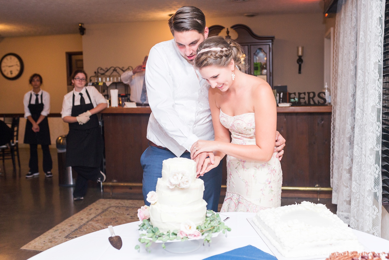 couple-cutting-their-cake