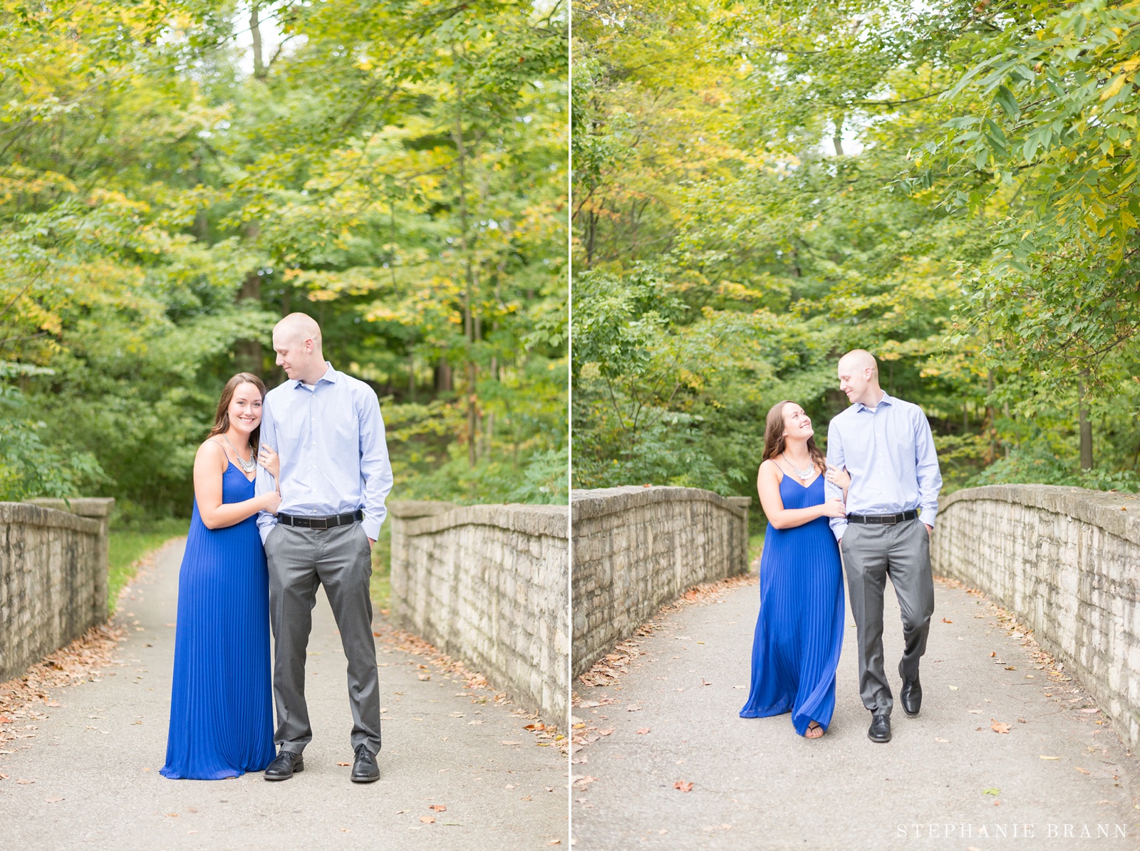 couple-standing-on-a-bridge-under-pretty-fall-trees