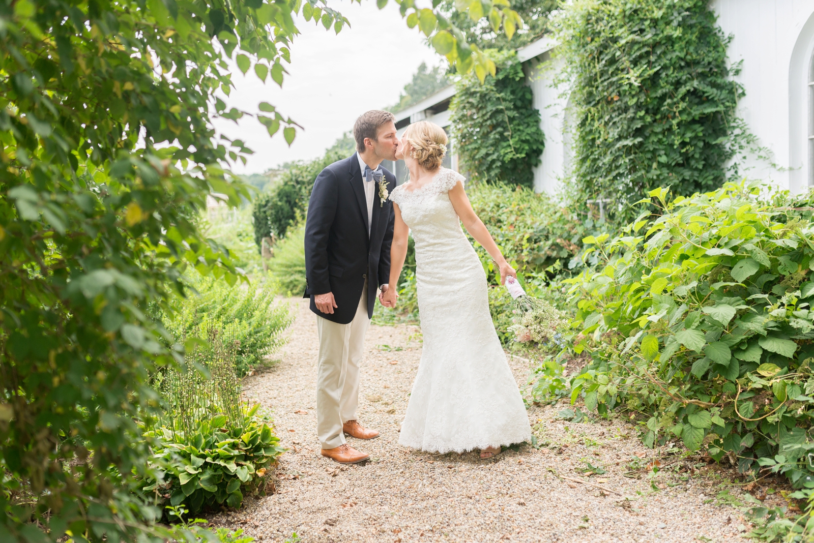 couple-kissing-under-green-trees