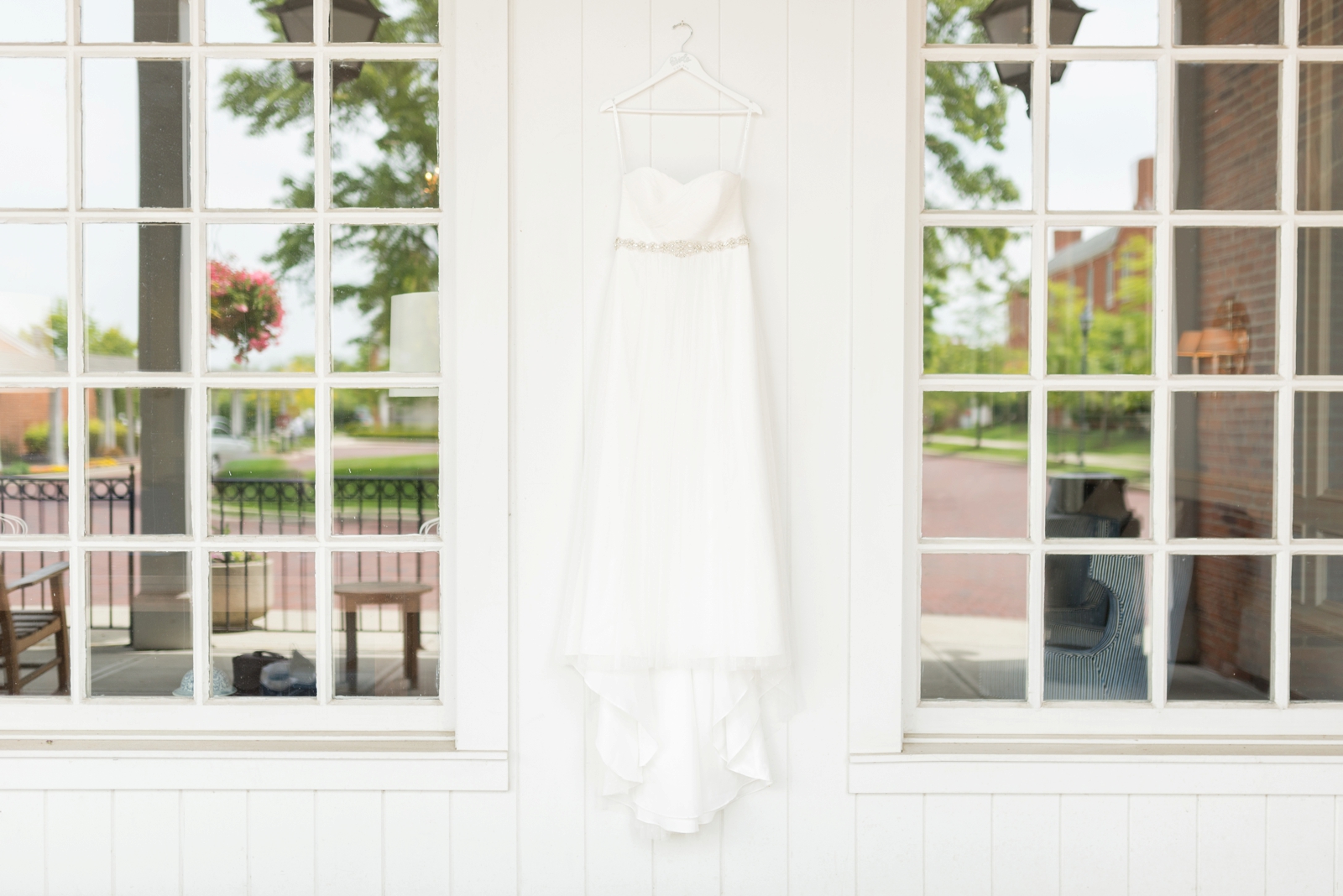 white-dress-hanging-on-a-porch