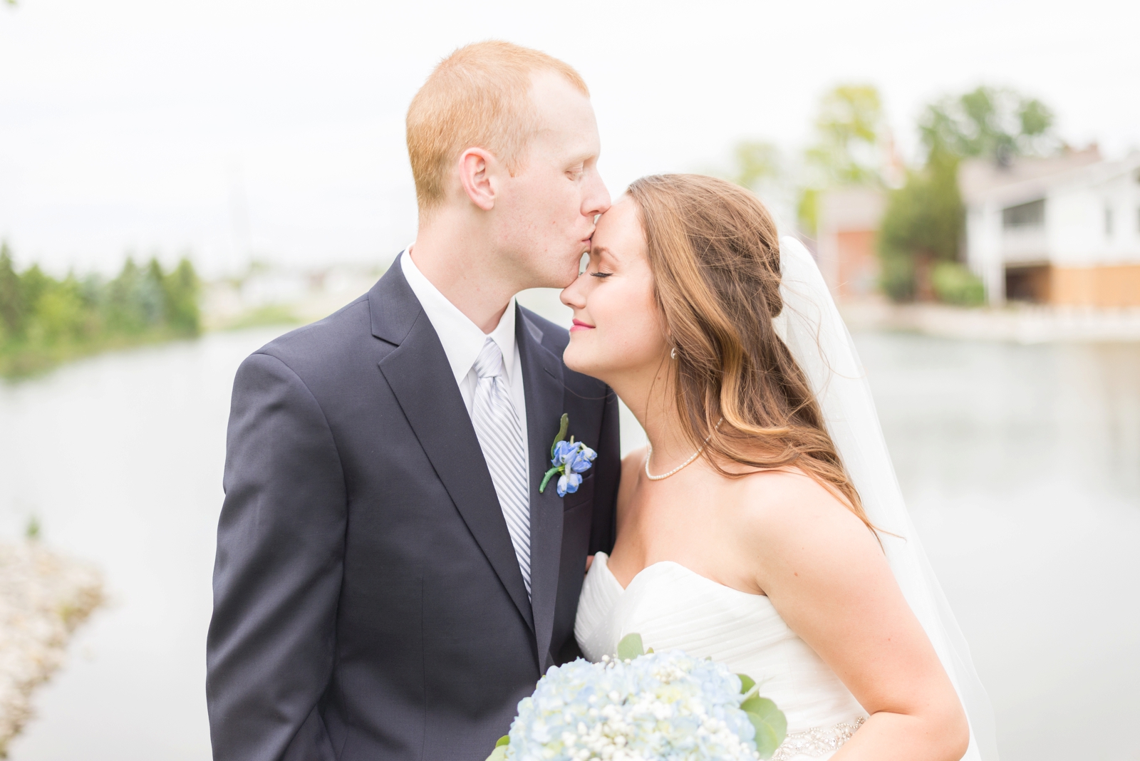groom-kissing-his-bride-on-the-forehead