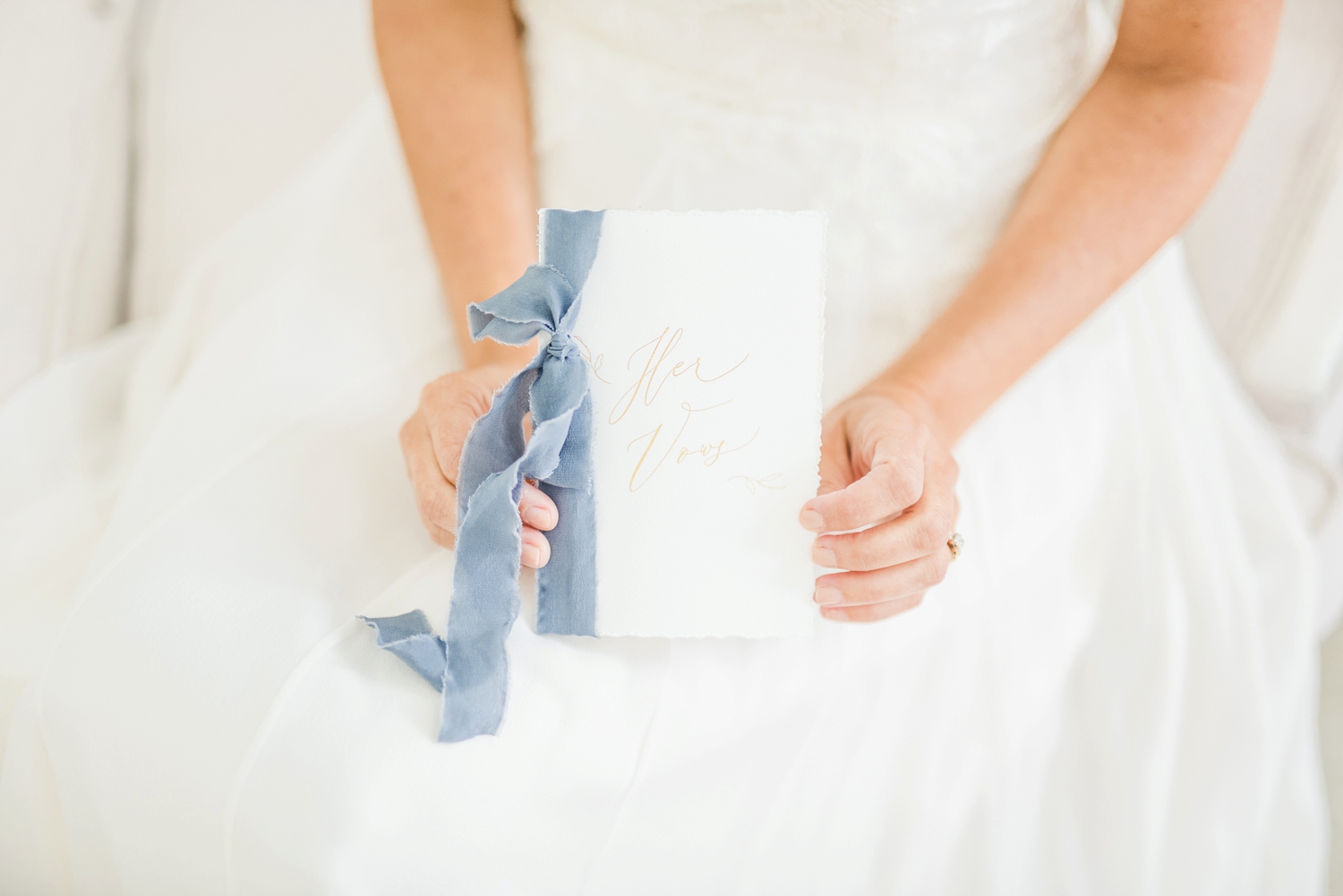 bride-holding-a-small-book-with-her-personal-hand-written-vows