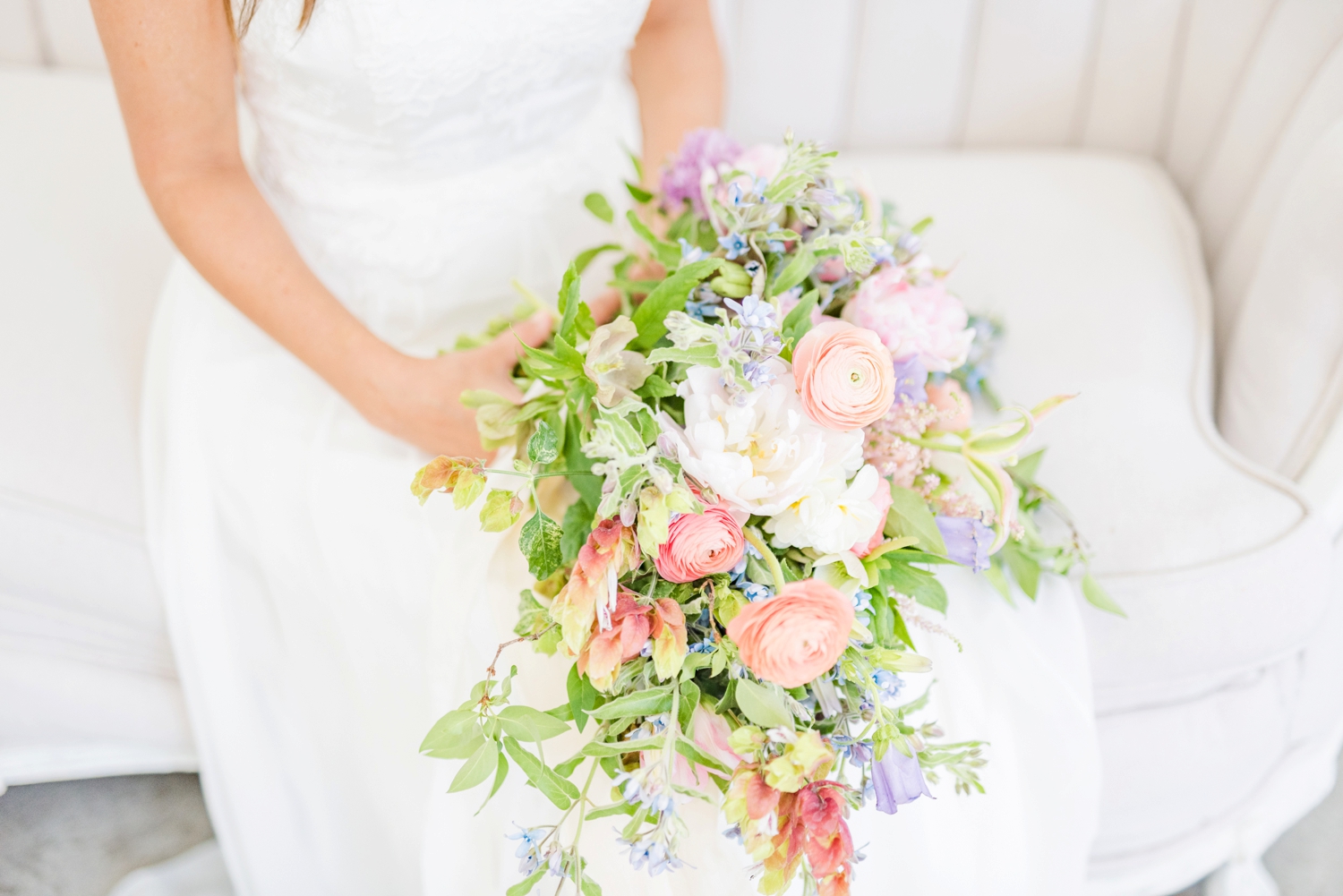 bridal-flowers-with-peach-blush-and-blue-colors-with-lots-of-greenery