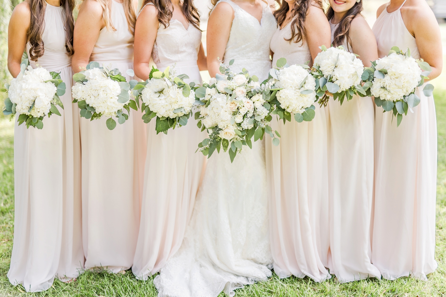 white-and-cream-bridesmaids-dresses-and-flowers