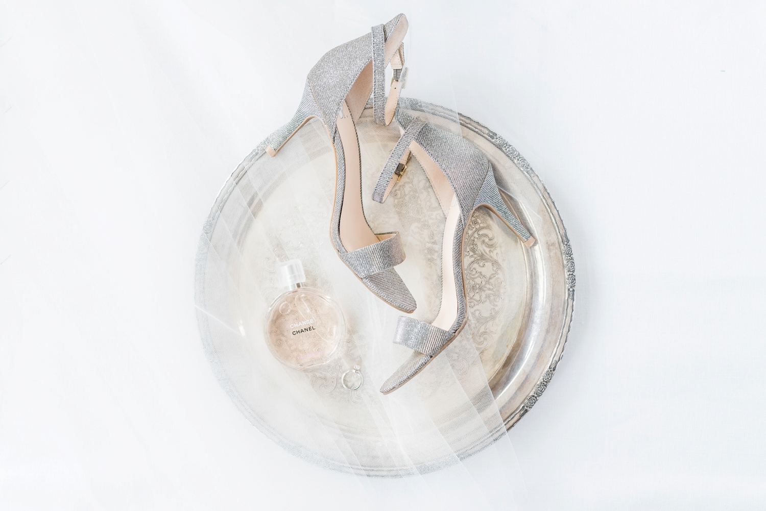 silver-tray-with-wedding-shoes-and-veil-and-perfume-styled-on-top-of-it