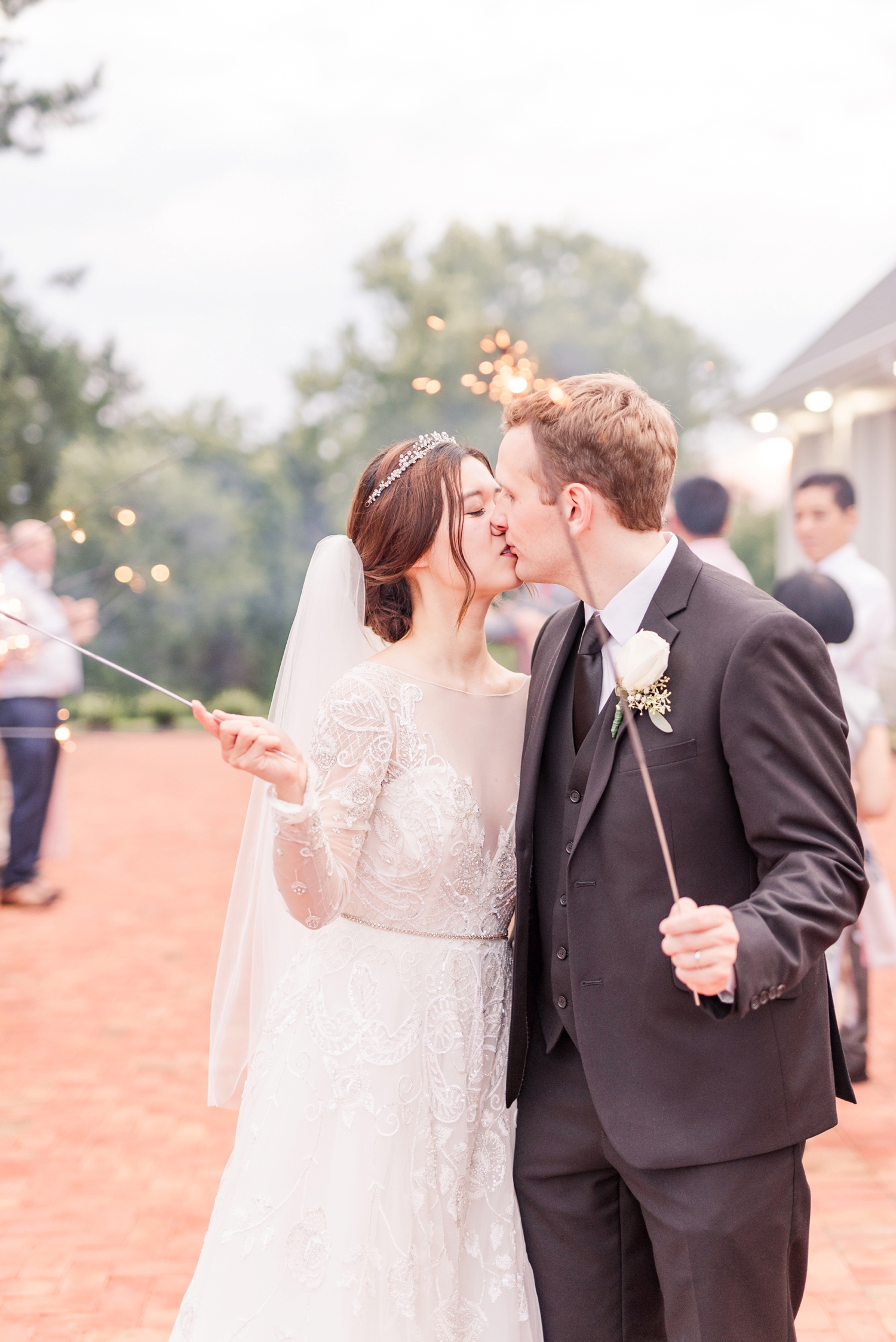 bride-and-groom-holding-sparklers-in-the-daylight