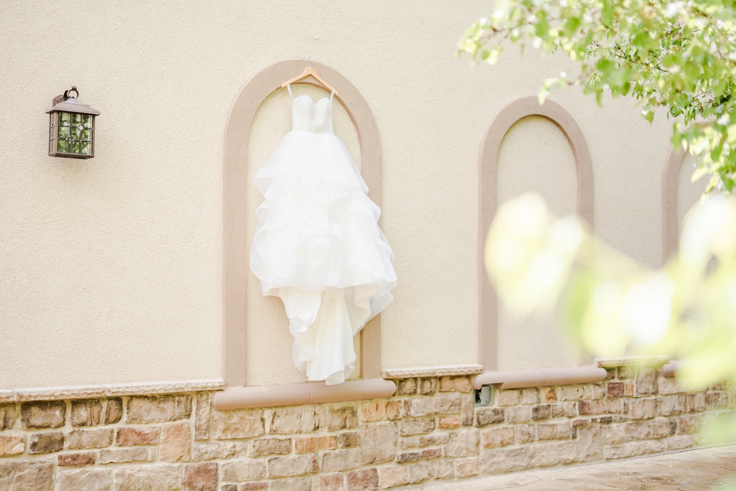 bride's-dress-hanging-from-a-wall