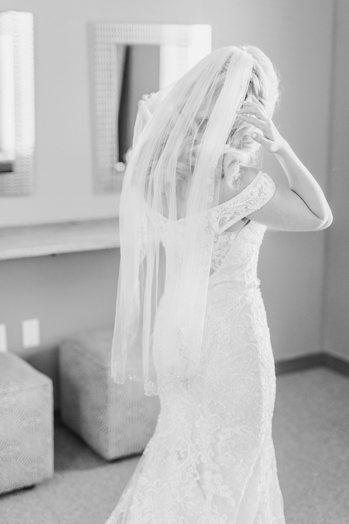 bride places veil on before Columbus OH wedding