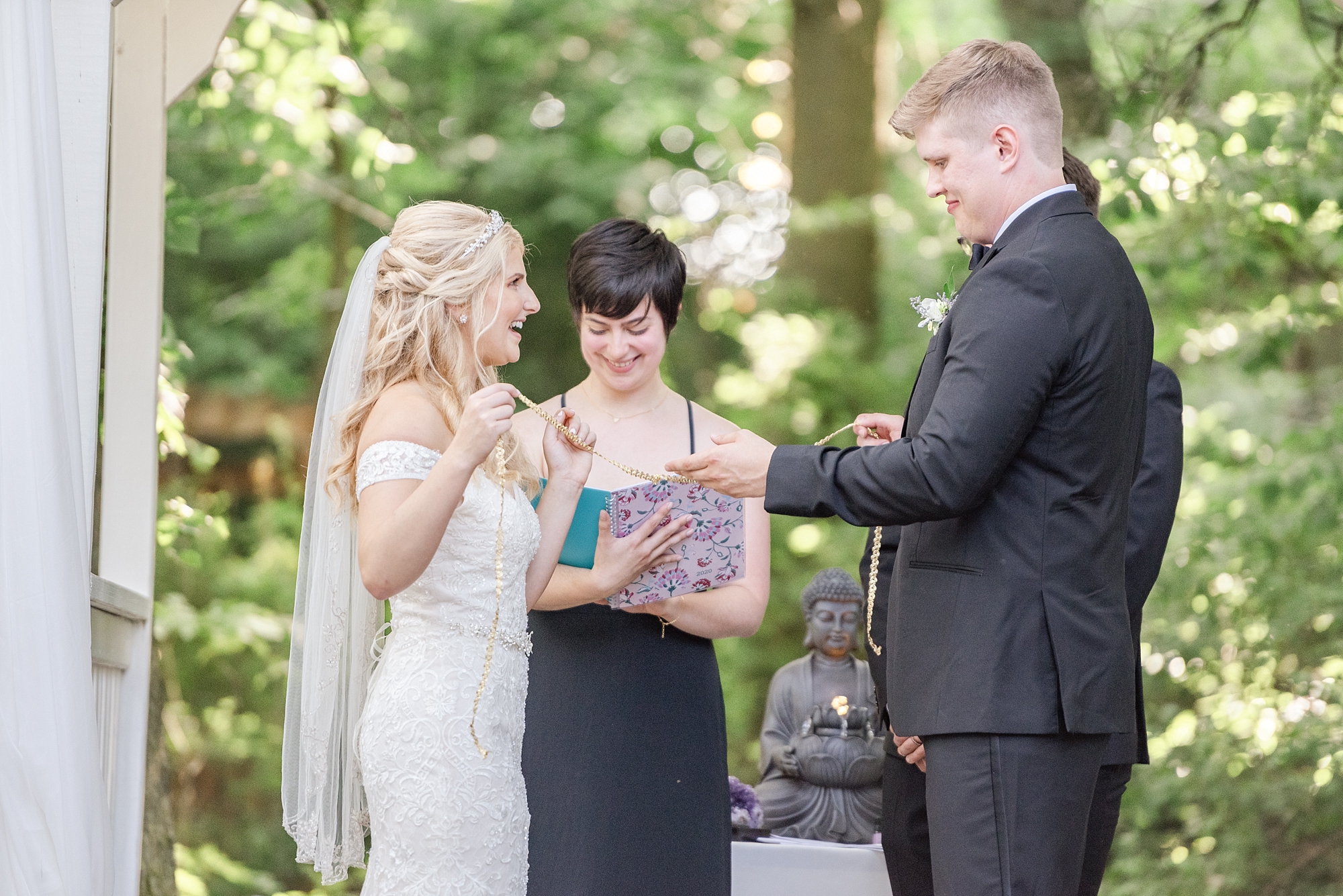 bride and groom exchange vows during outdoor wedding ceremony in Columbus OH