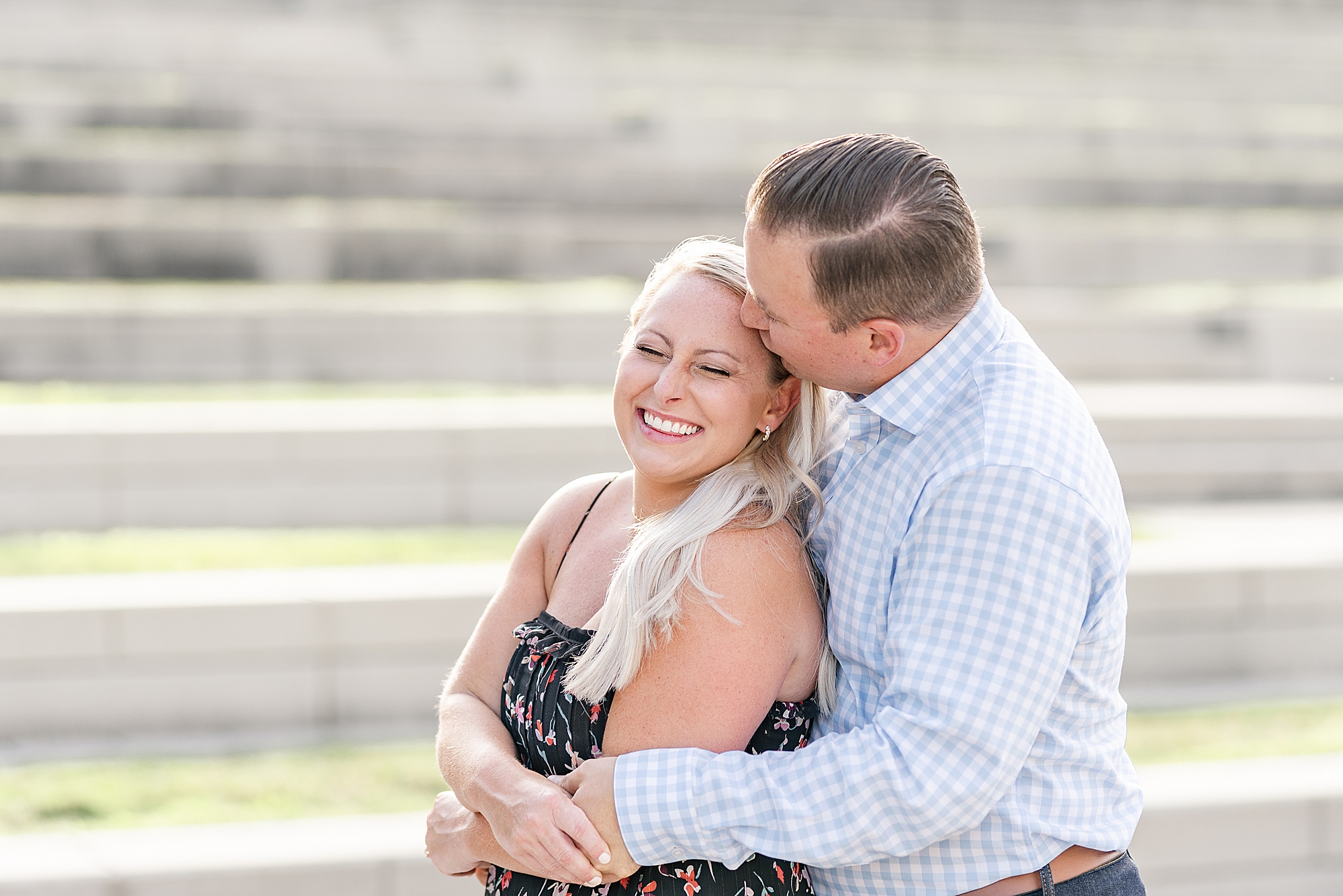 groom kisses bride on the forehead during engagement portraits in Ohio