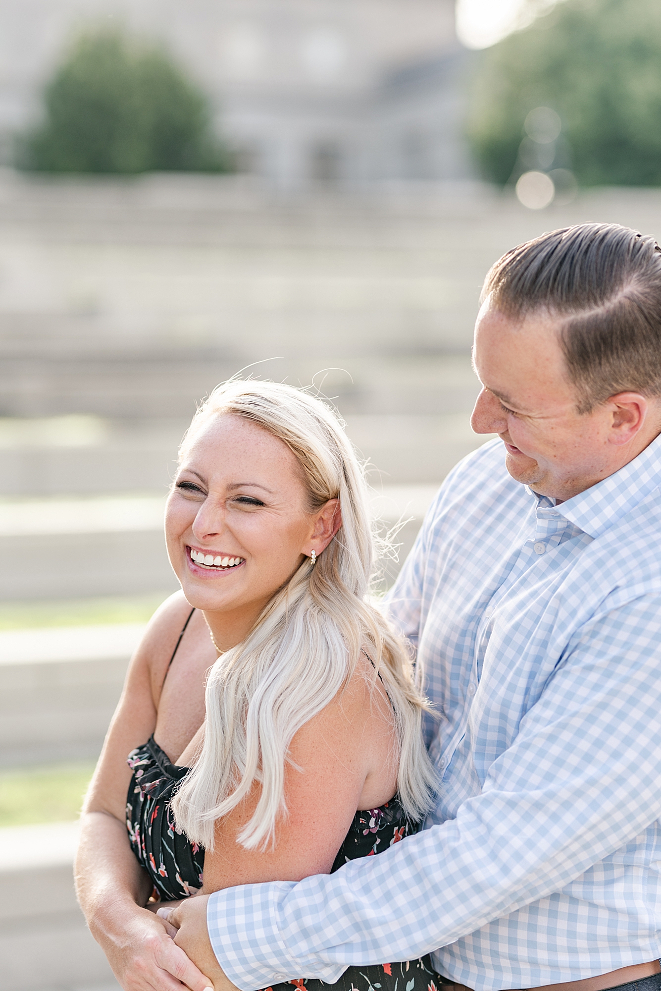 bride and groom laugh during Ohio engagement portraits
