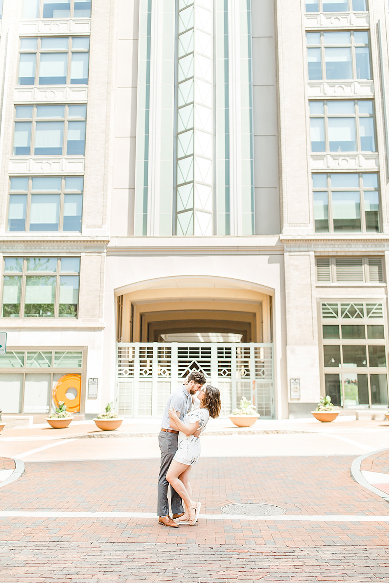 married couple poses outside apartments in Columbus OH