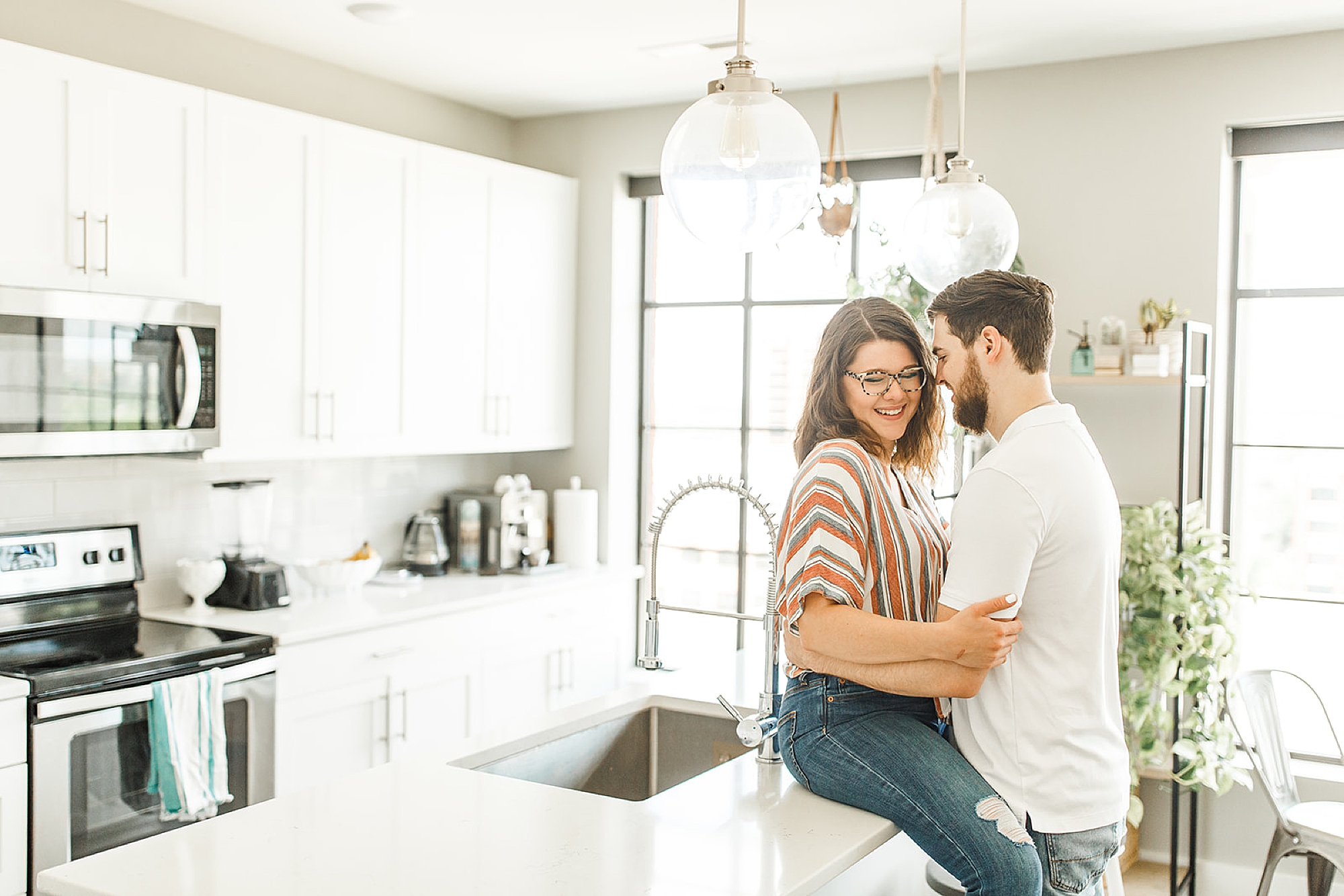 third anniversary photos in kitchen with Ohio educator and husband