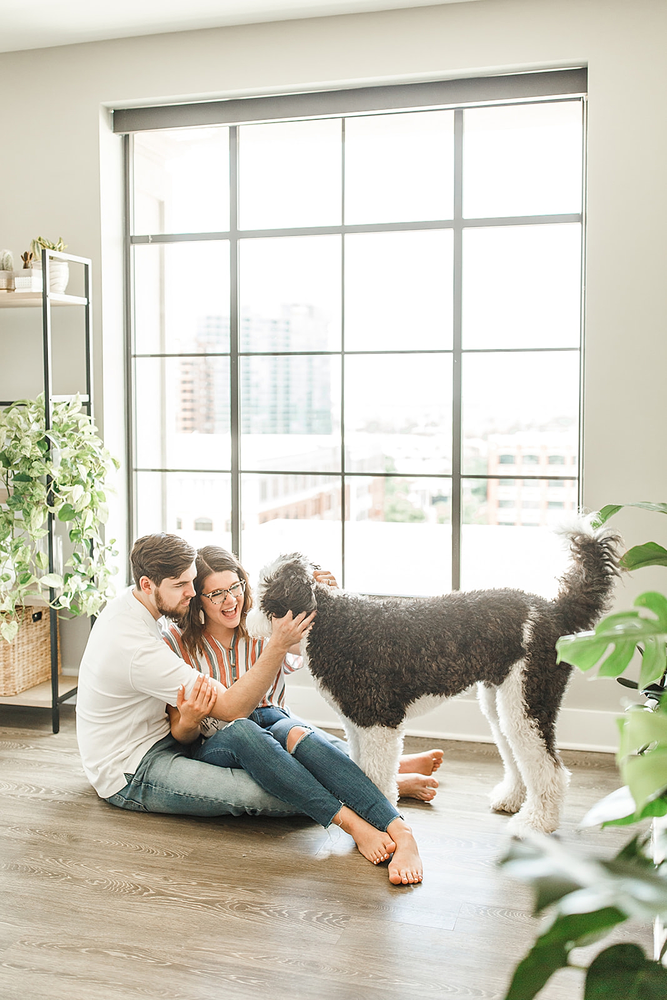 husband and wife pet dog during lifestyle anniversary photos