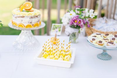 cake pops with bright yellow frosting for baby shower