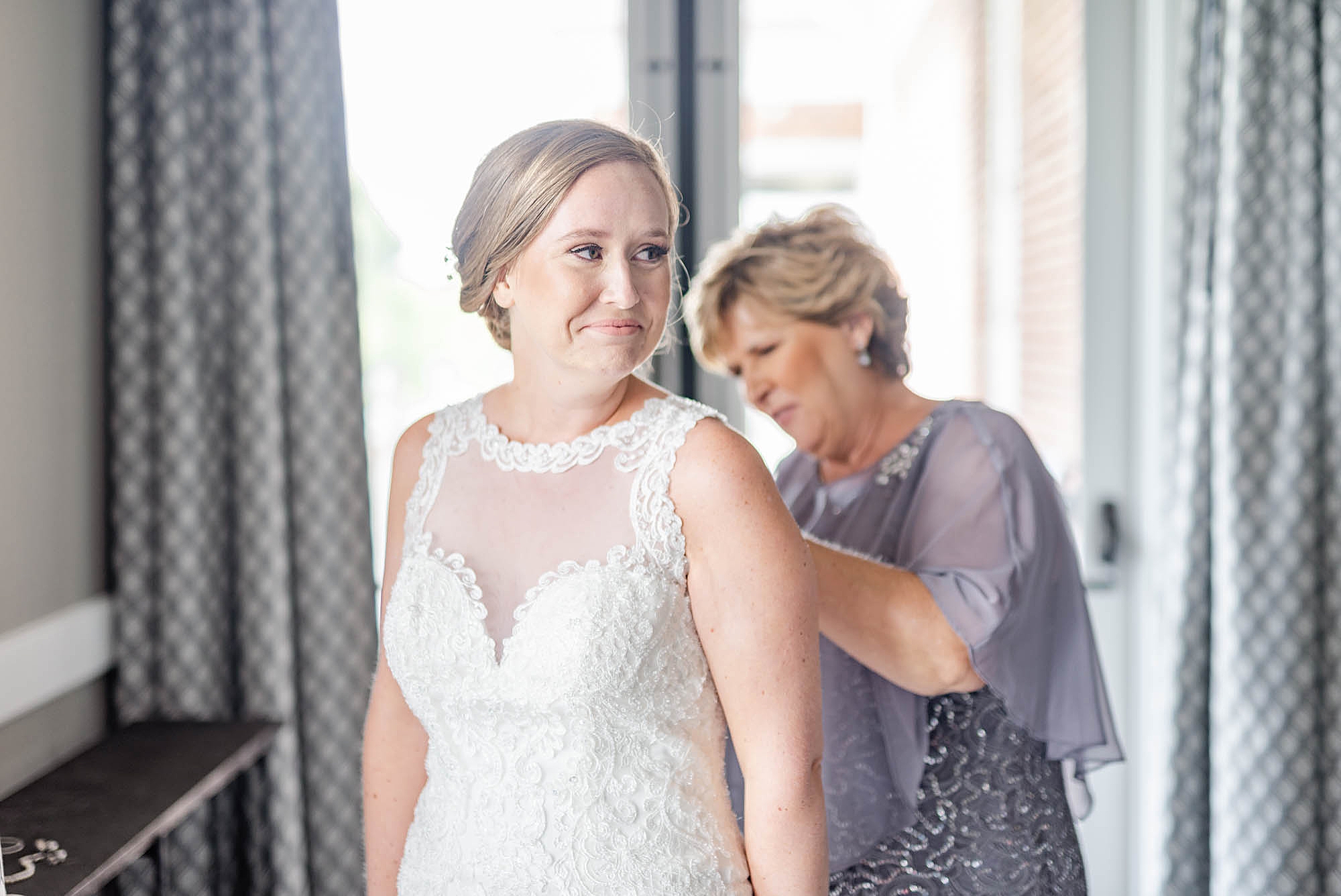 mom adjusts bride's dress before Wedgewood Golf & Country Club wedding
