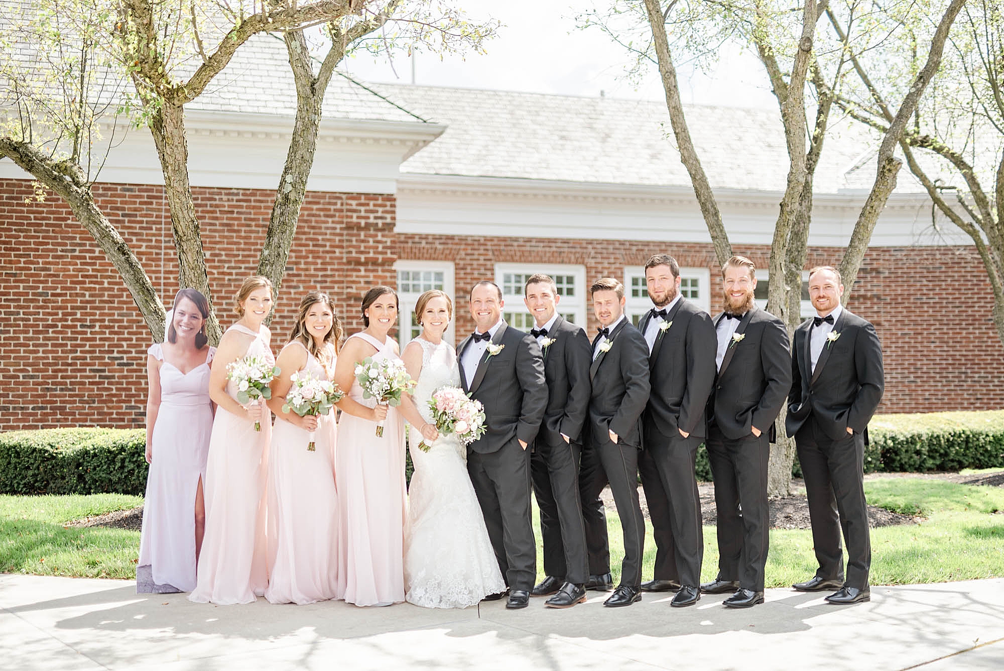 bridal party in pink gowns and tuxes at Wedgewood Golf & Country Club