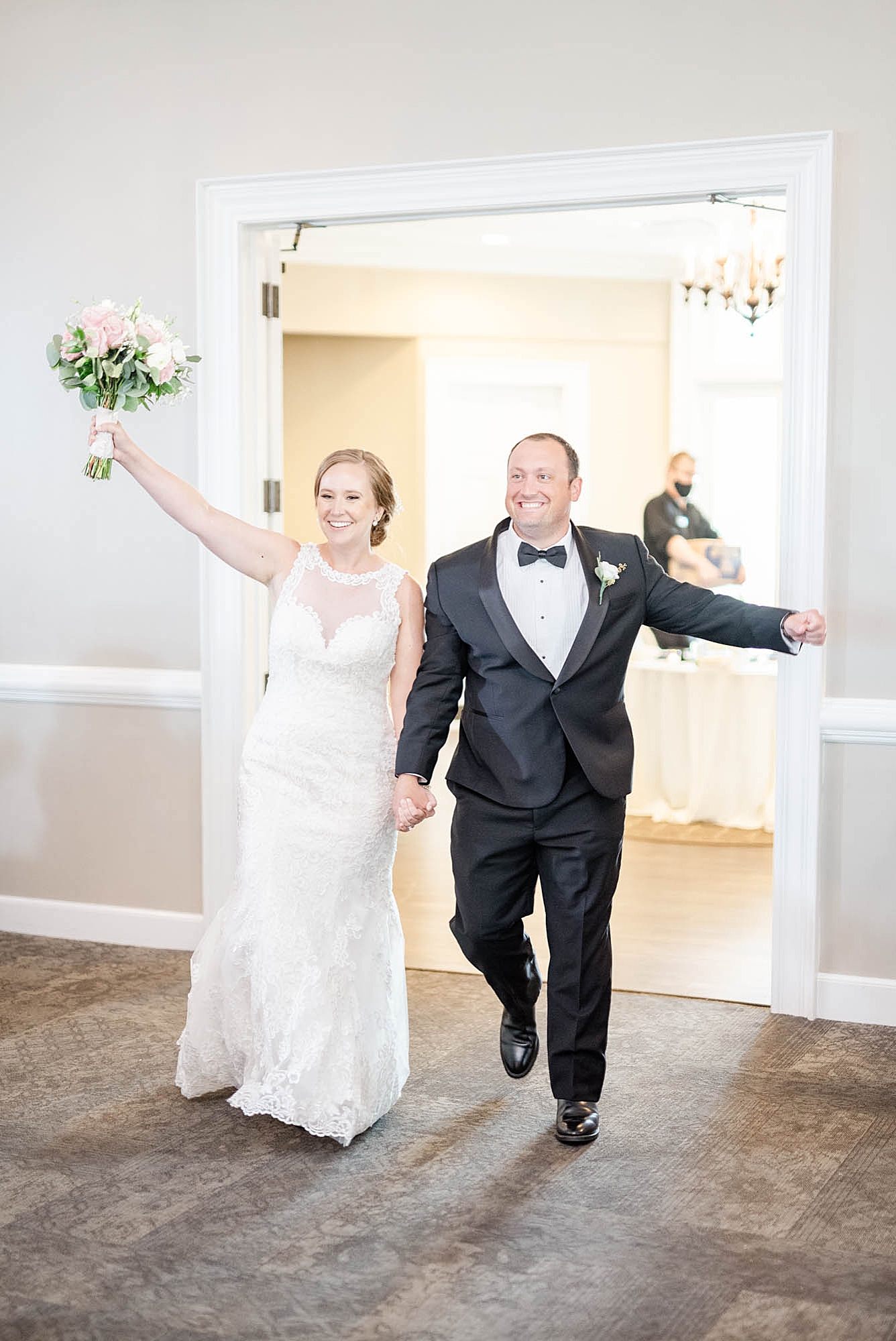 bride and groom enter wedding reception at Wedgewood Golf & Country Club