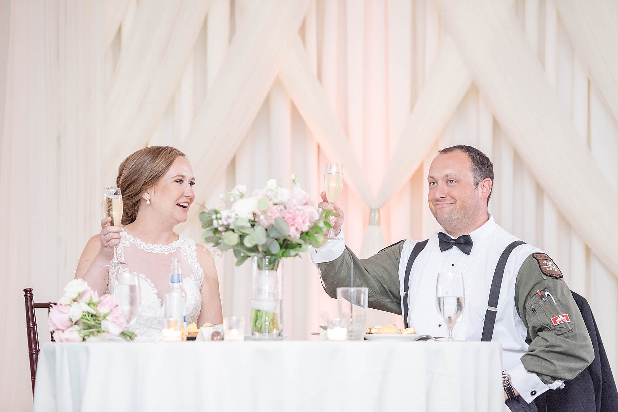 bride and groom laugh during wedding toasts at Wedgewood Golf & Country Club