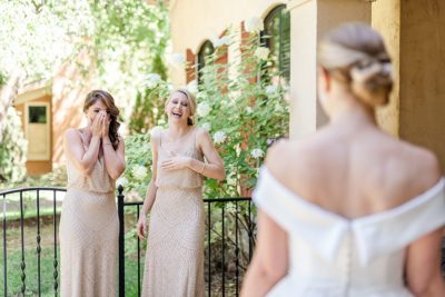 bridesmaid first look with bride in classic gown