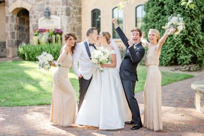 bride and groom pose with bridesmaids and groomsman in Ohio