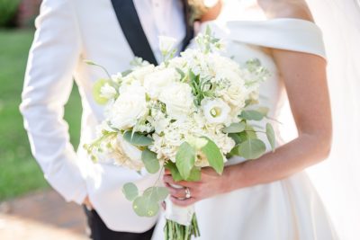 bride holds all-white bouquet during Ohio wedding portraits