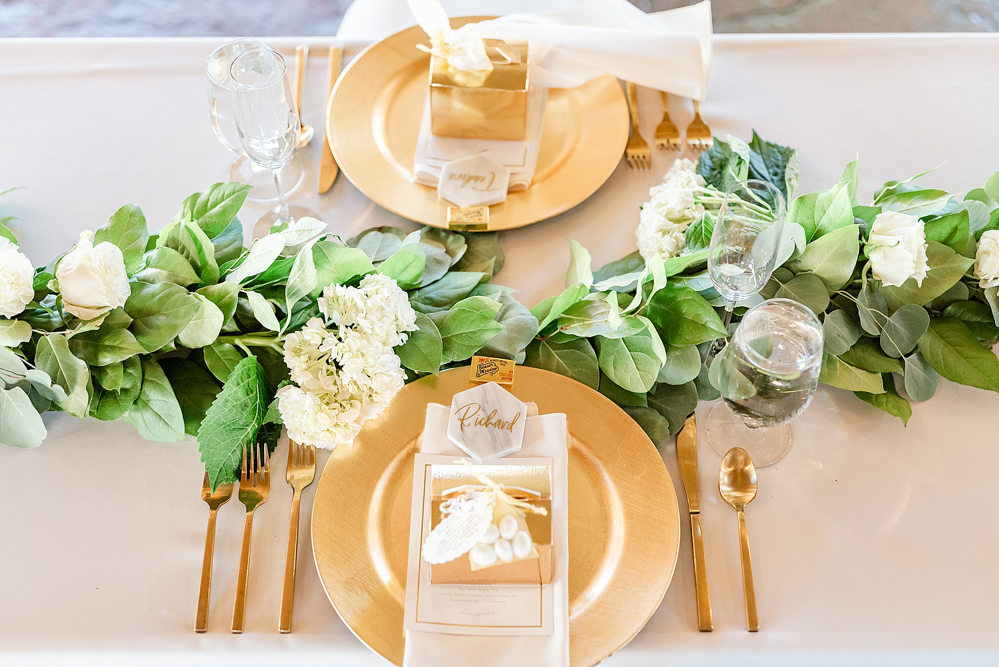 Ohio wedding reception with greenery draped along table