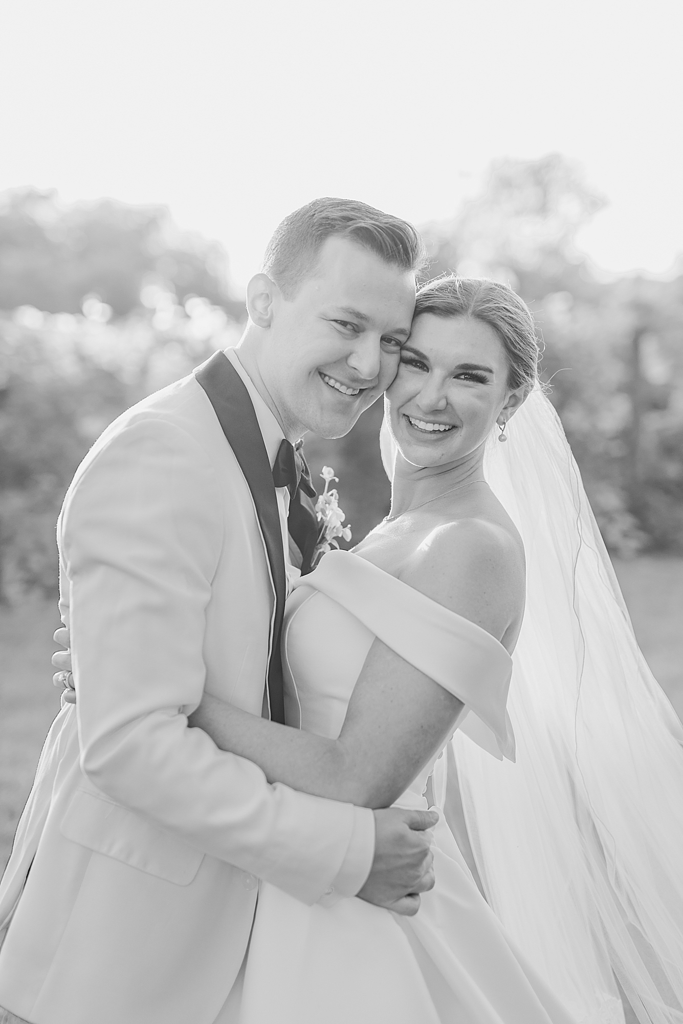 bride and groom smile during wedding portraits in Ohio