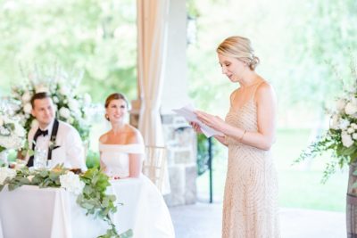 bridesmaid reads toast during Ohio reception