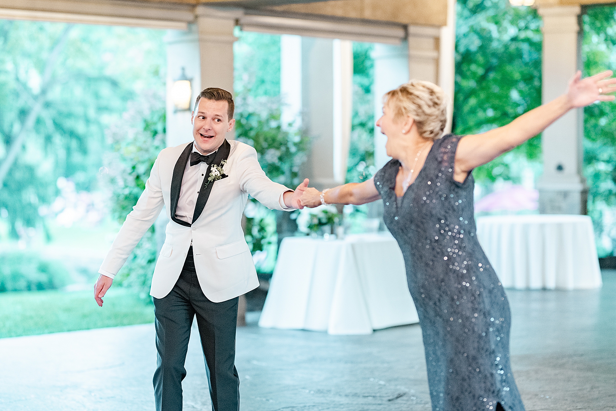 groom and mom dance during wedding reception