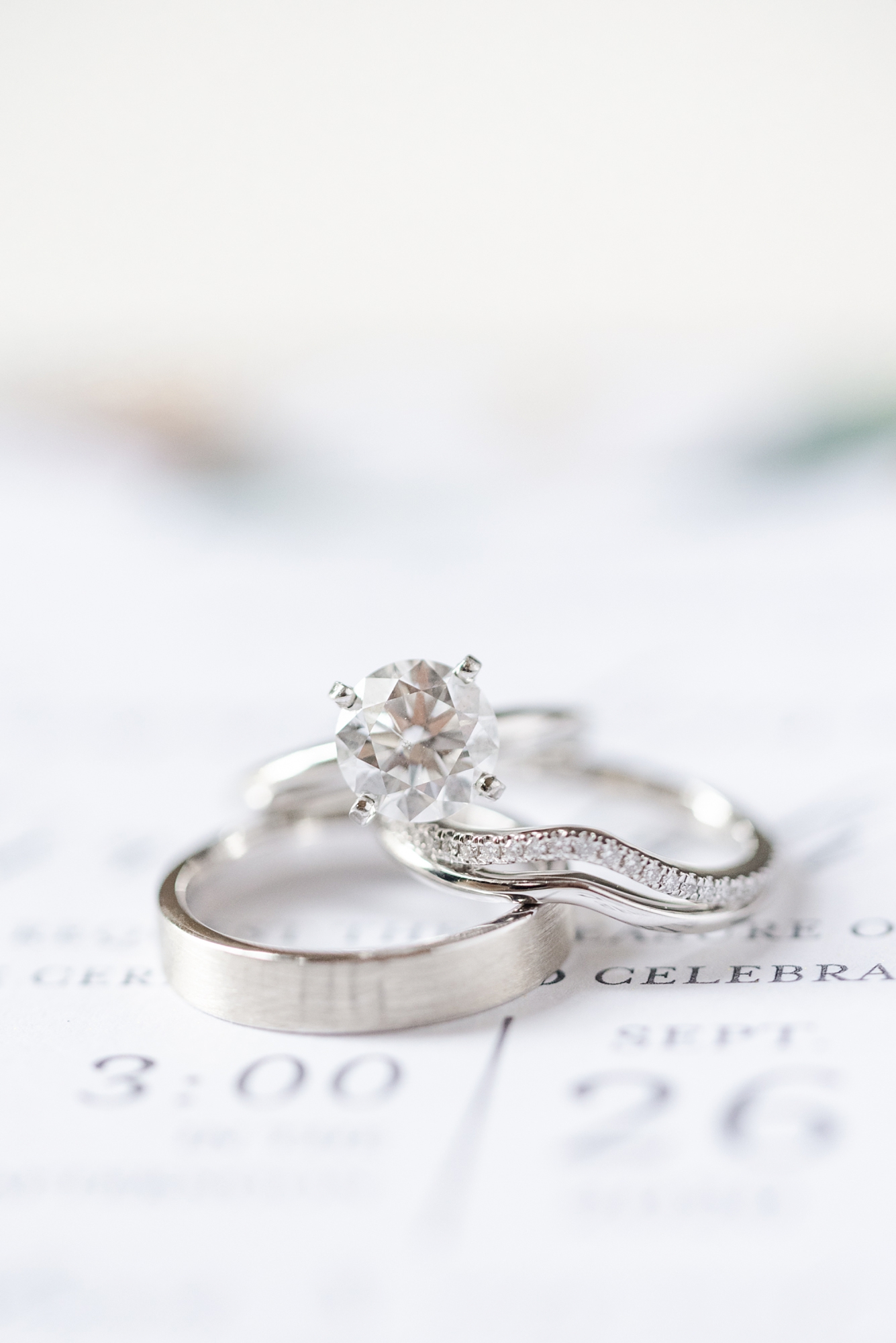 wedding ring rests on invitation for Savannah GA wedding