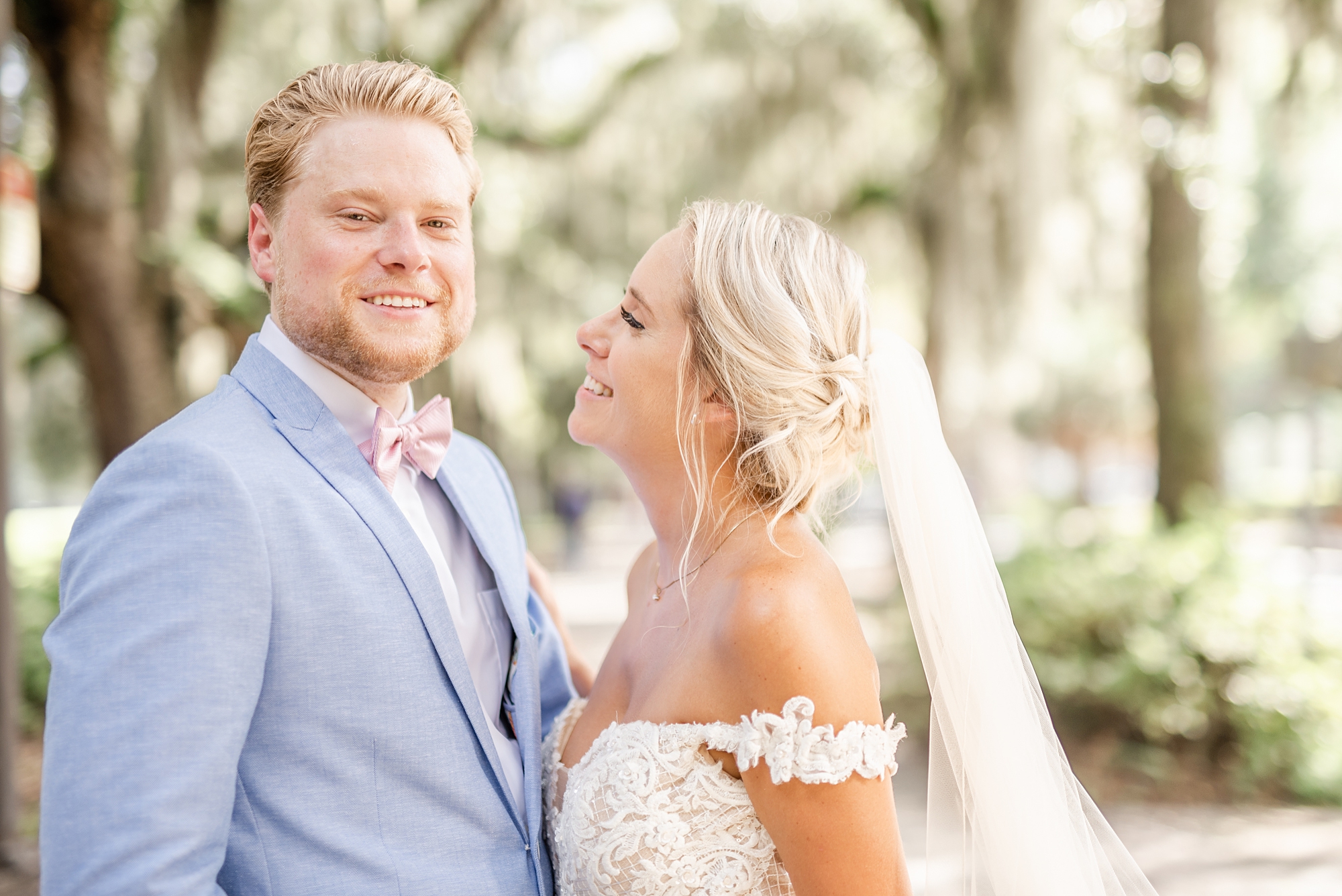 bride and groom laugh together during GA wedding portraits