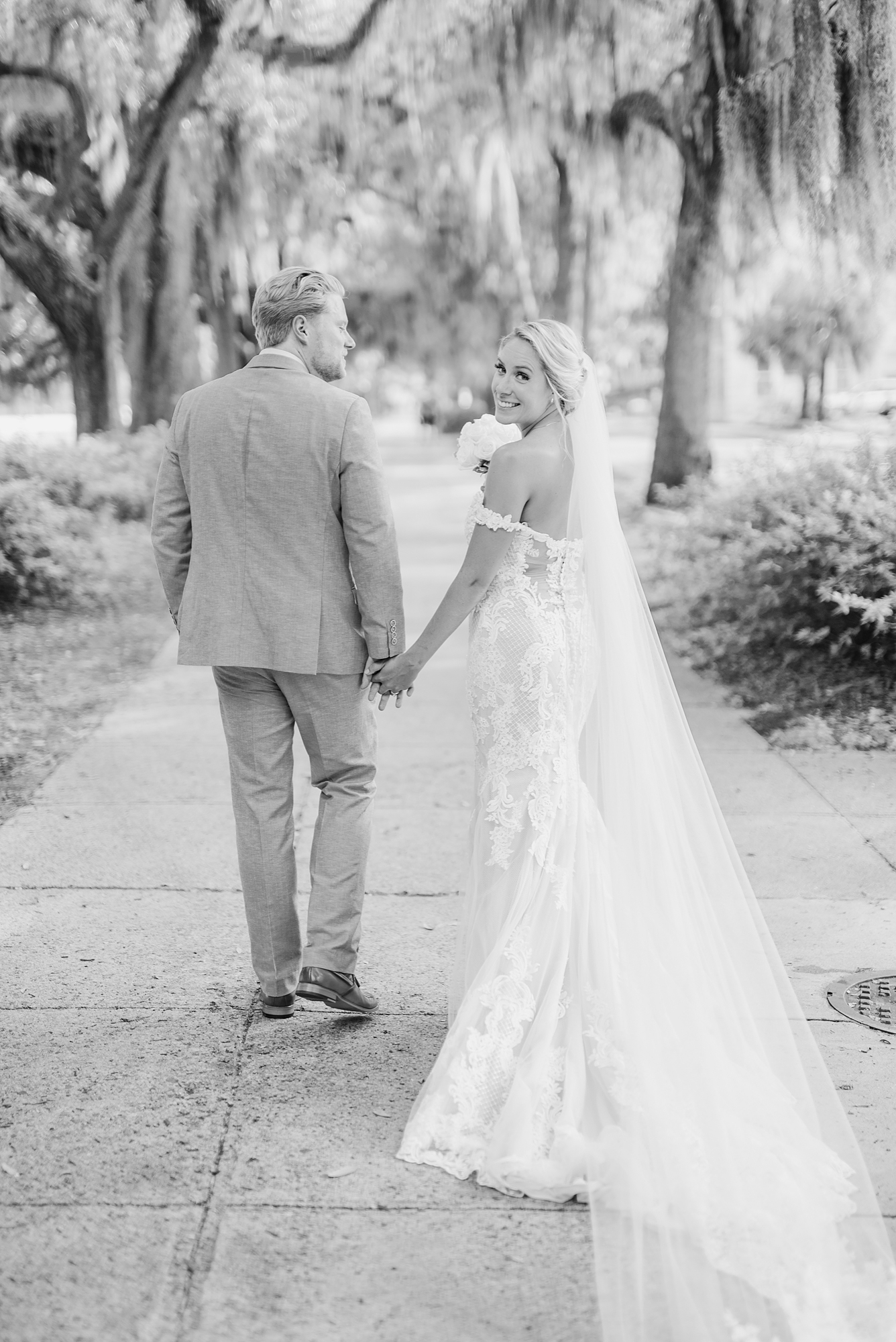 newlyweds walk in downtown Savannah GA after getting married