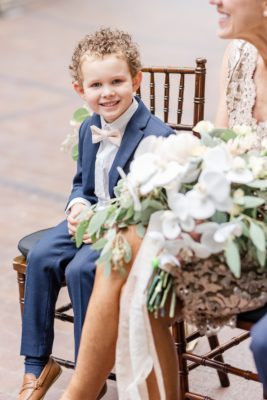 son watches parents during wedding ceremony