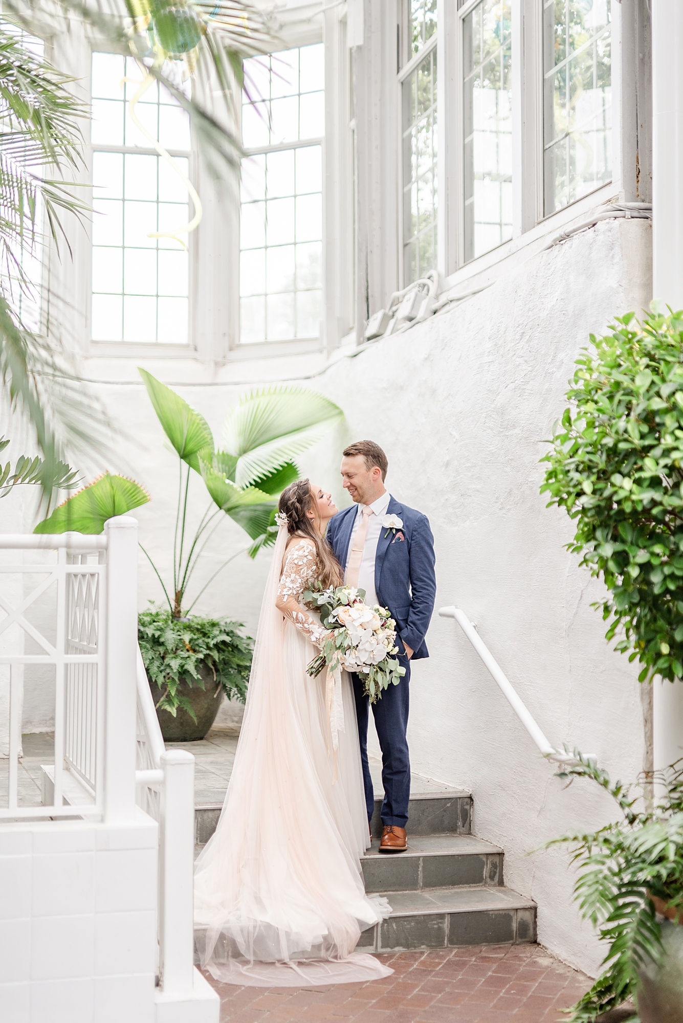 Ohio wedding portraits on staircase in Franklin Park Conservatory