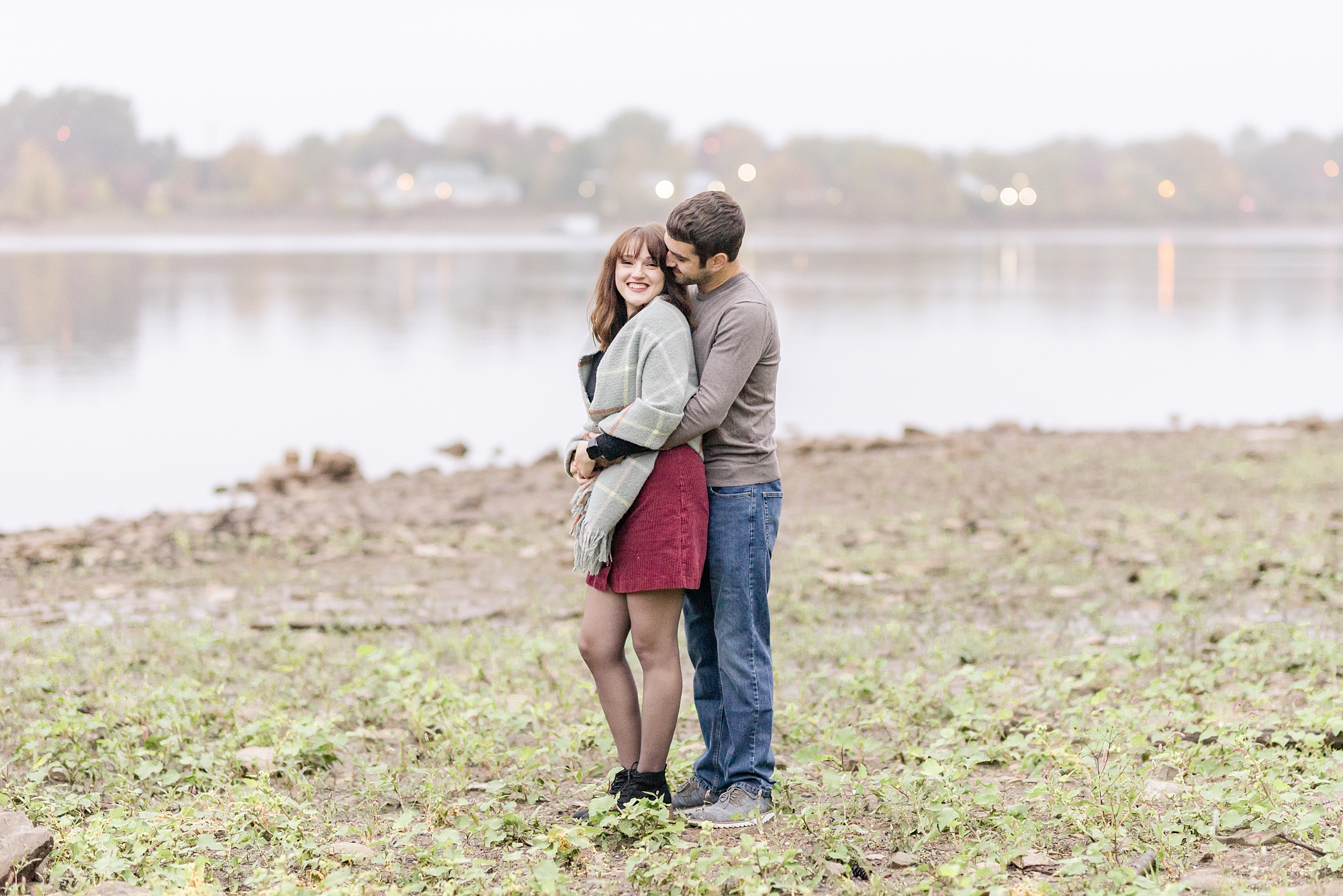 husband hugs wife during first anniversary portraits