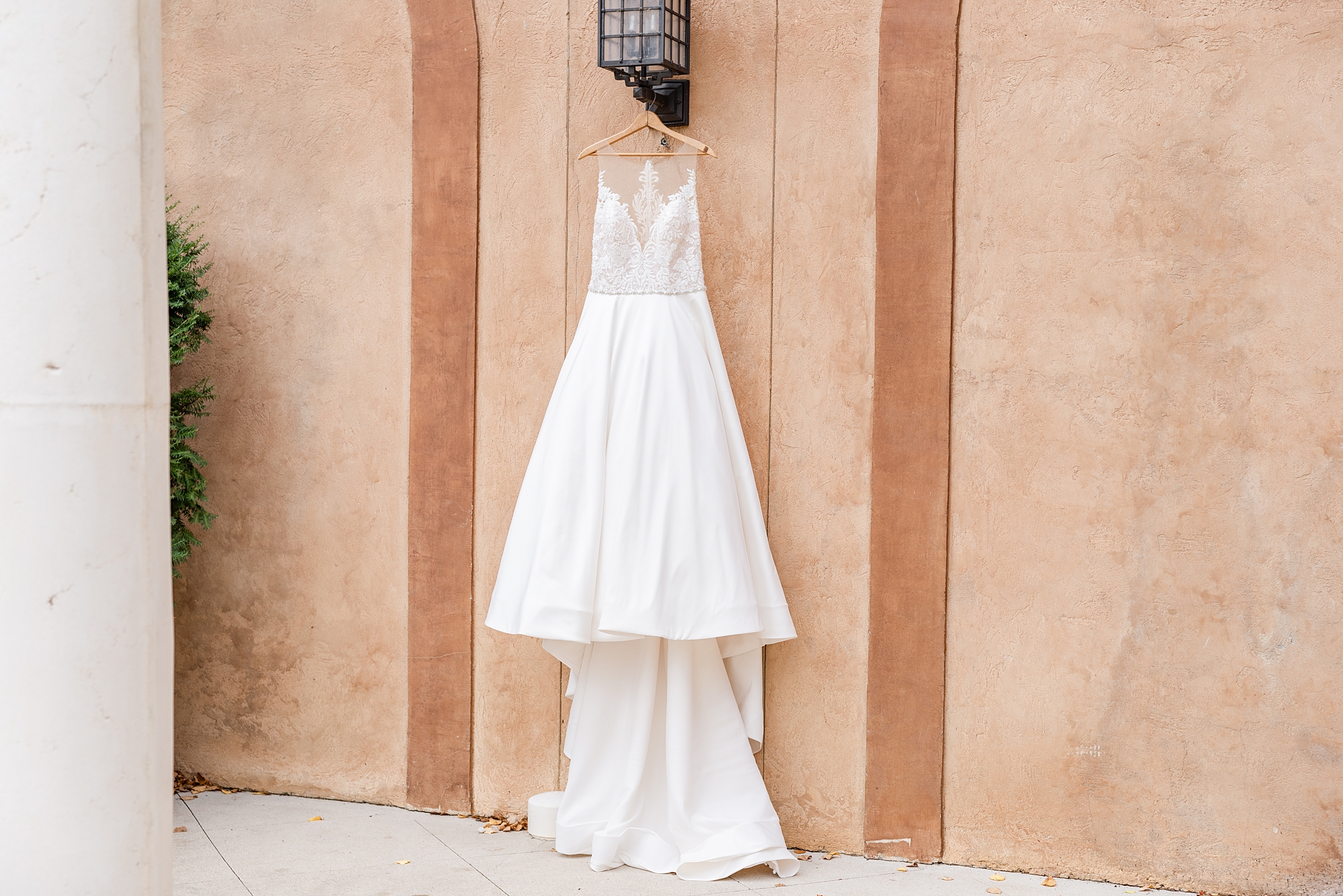 wedding dress hangs outside The Club at Corazon