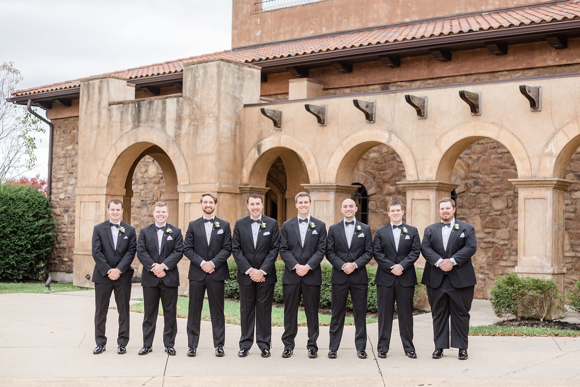 groomsmen lined up outside The Club at Corazon