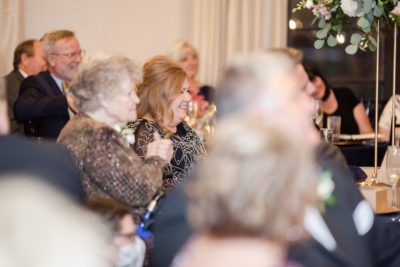 family claps during wedding toasts