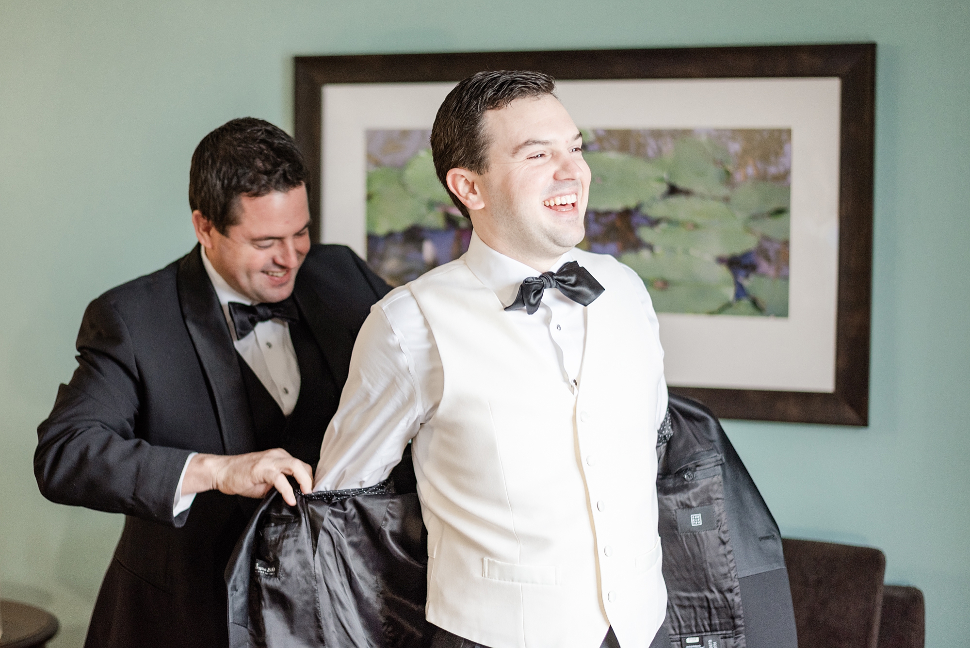 groom gets into jacket for Dayton Ohio wedding
