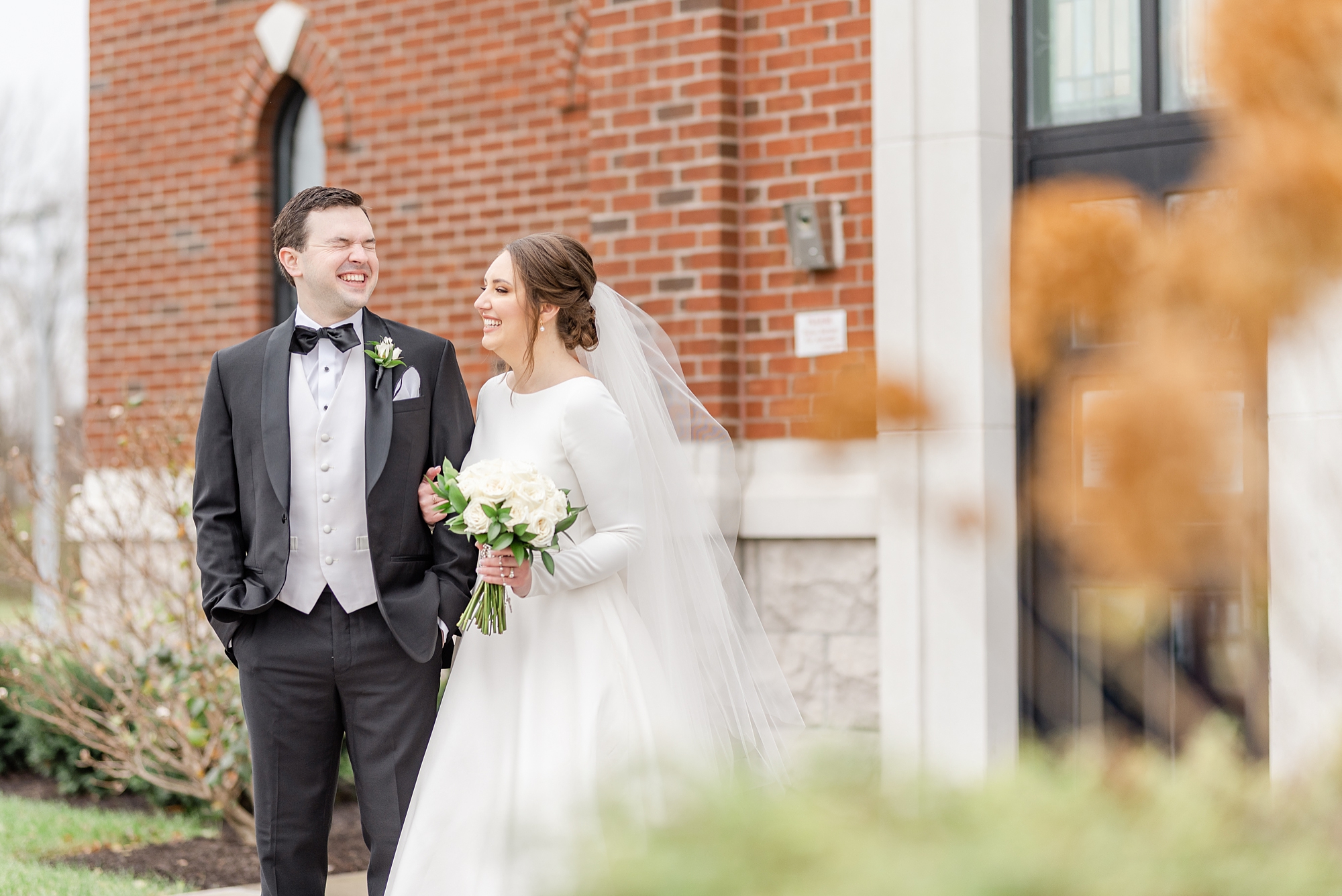 bride and groom laugh during portraits in Dayton OH