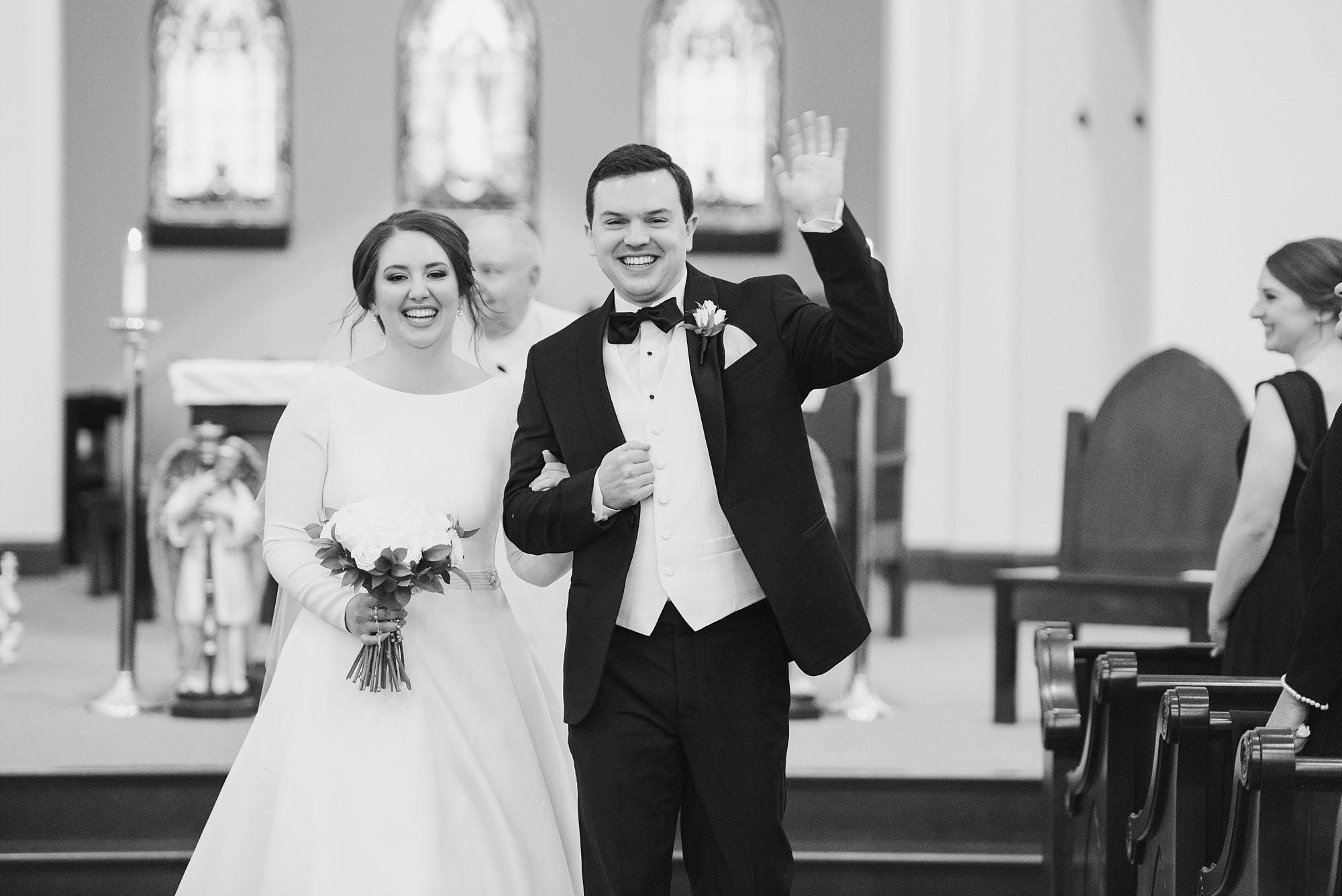 newlyweds walk up aisle after traditional church wedding in Ohio