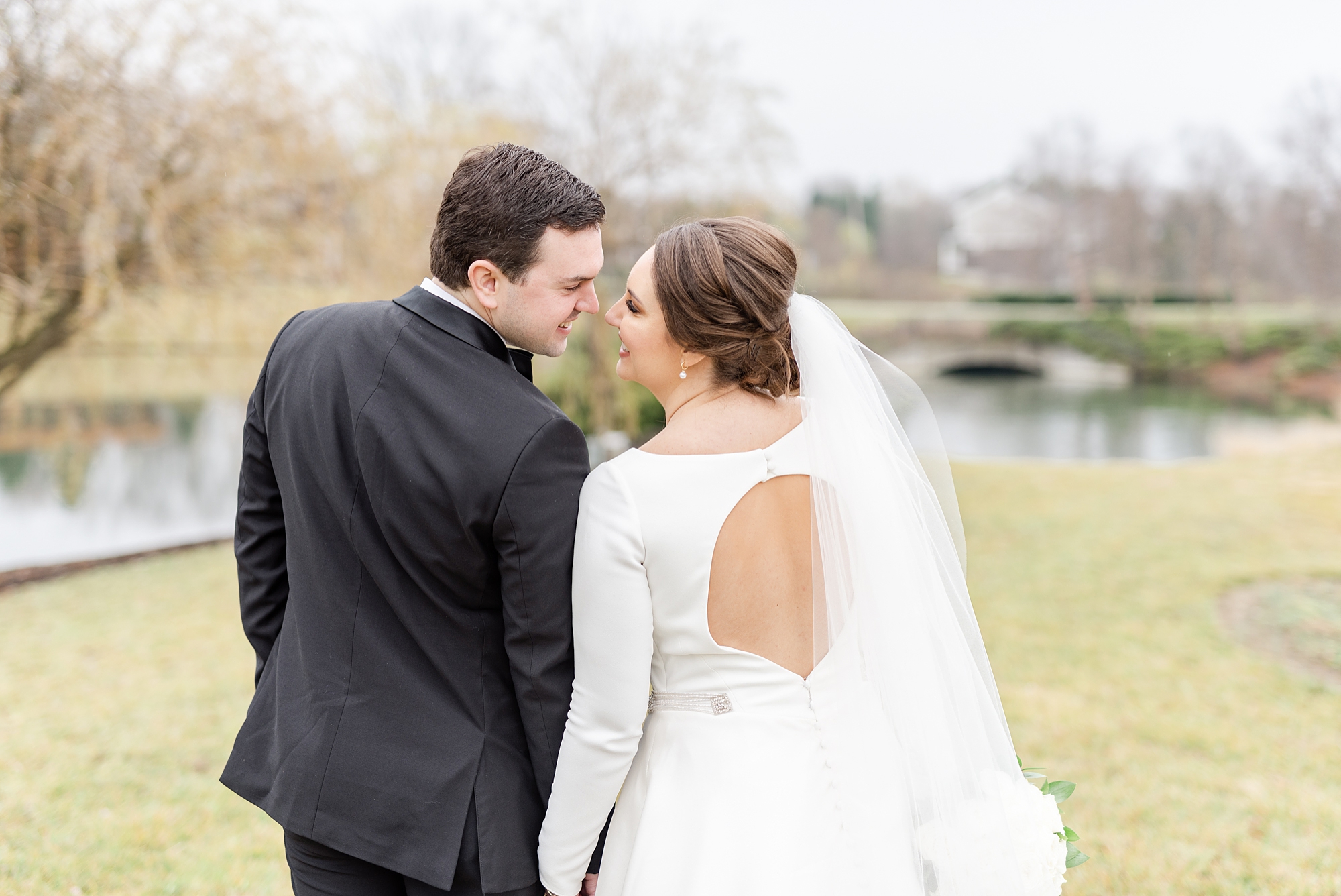 bride and groom touch noses during Ohio wedding portraits