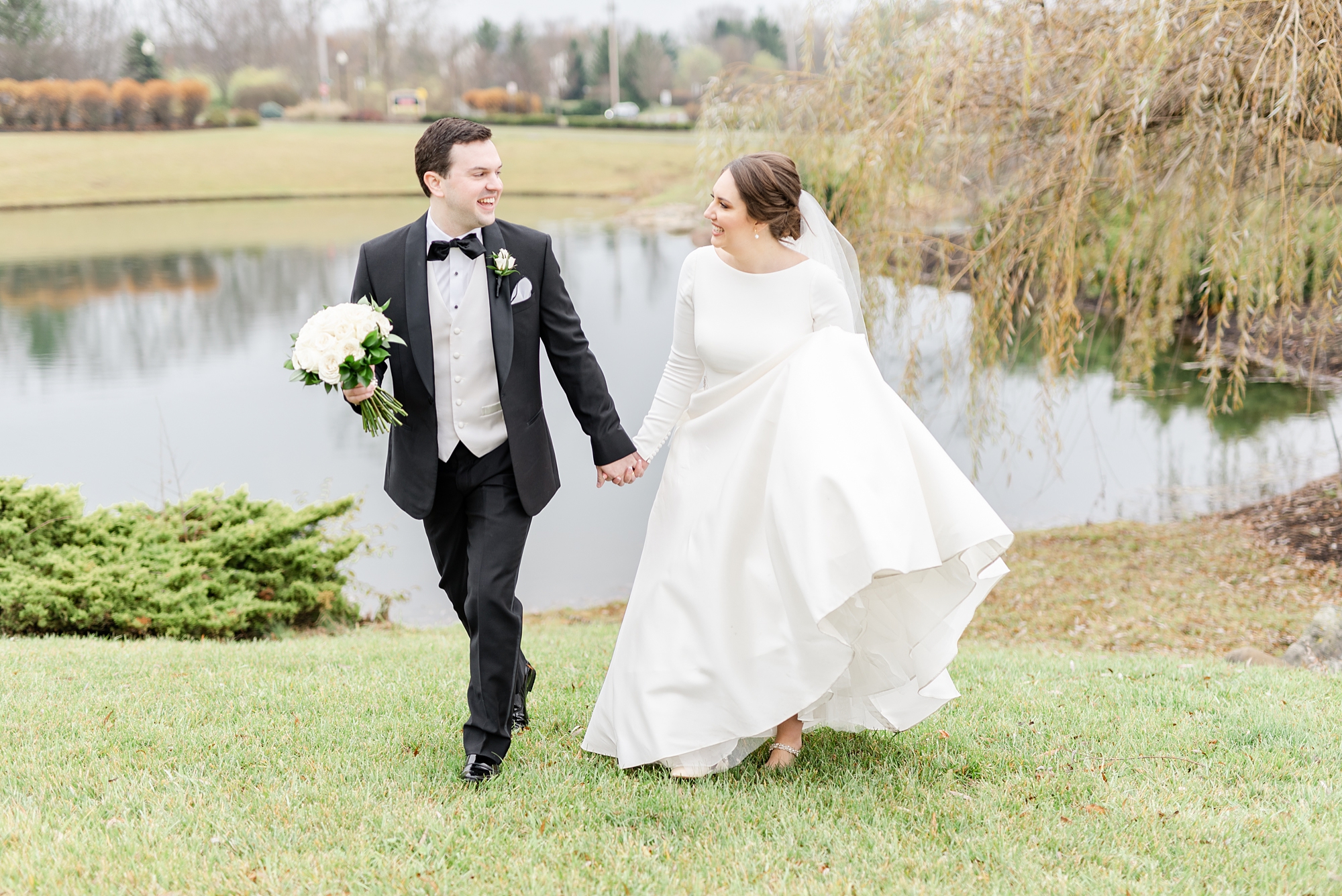 couple walks together after classic Ohio wedding
